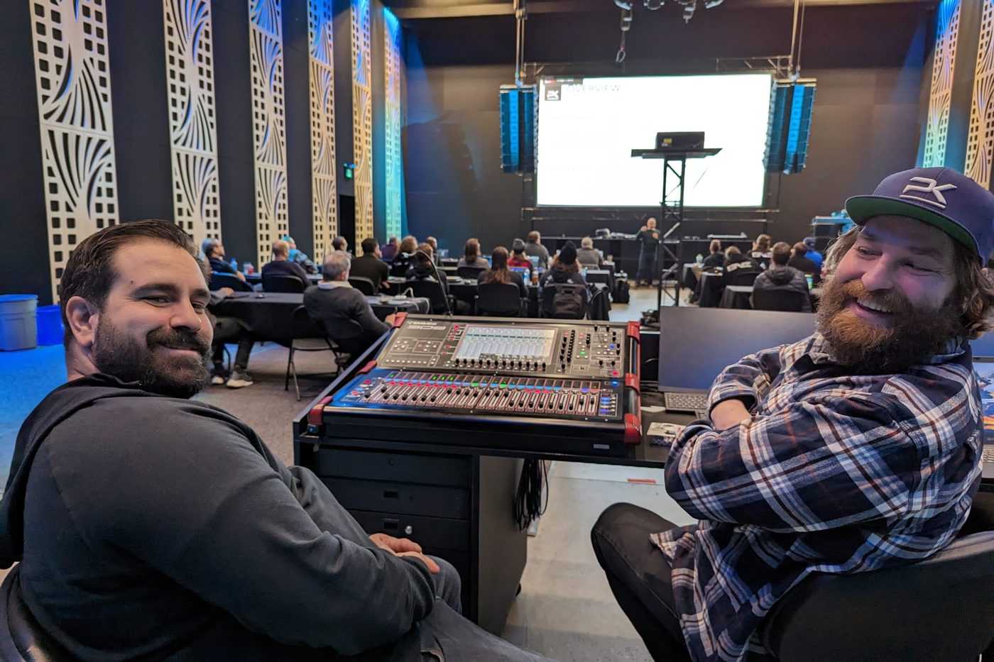 Two engineers at the console during a system session